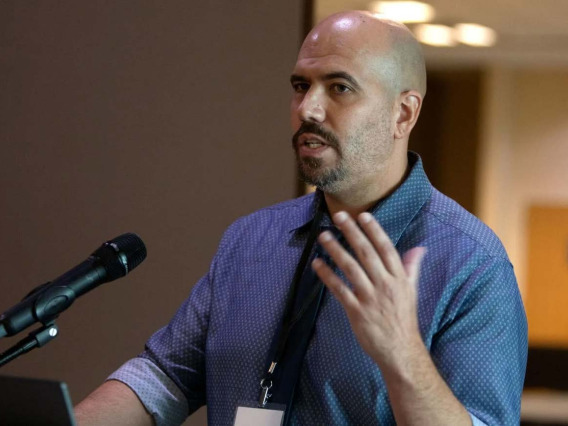 Image of Dr. Martinez speaking at the Conference